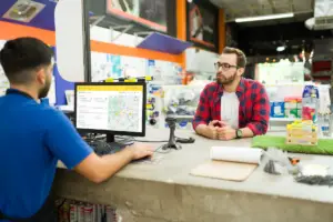 Retail associate helps customer schedule home delivery using Bungii delivery portal