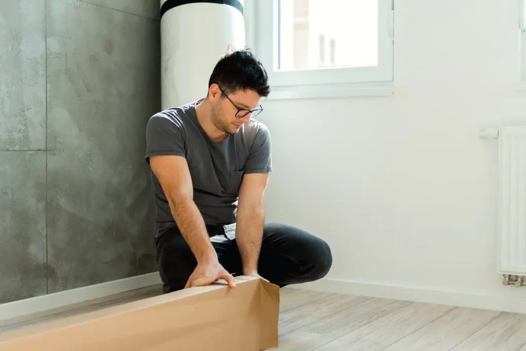 Man unpacking furniture
